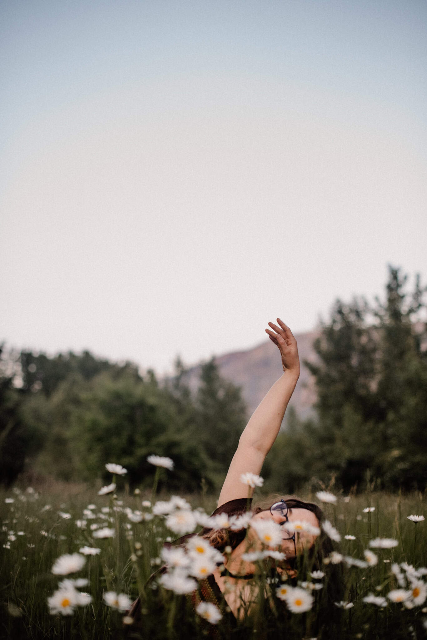 woman in flowers during an immersive art somatic experience