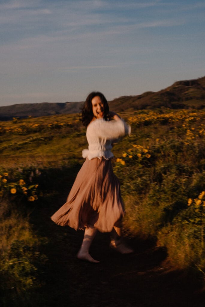 woman dancing near flowers