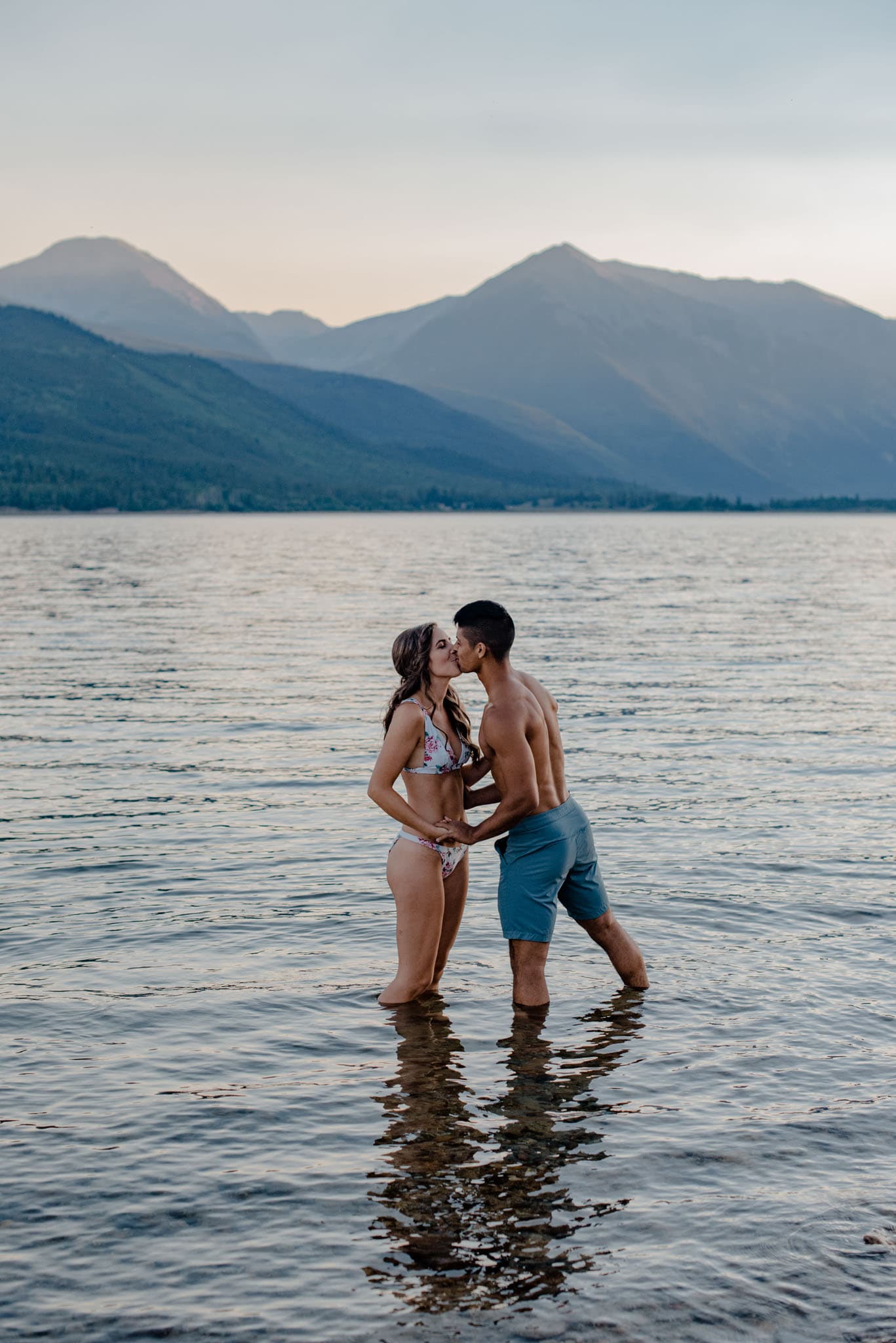 couple kissing on a river front during couple photography session near Porltand Oregon