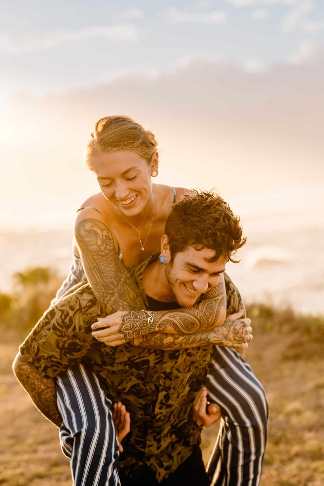 Couple holding each other during susnet for engagement photos with Portland Photographer Lumalia with Celebrate Again