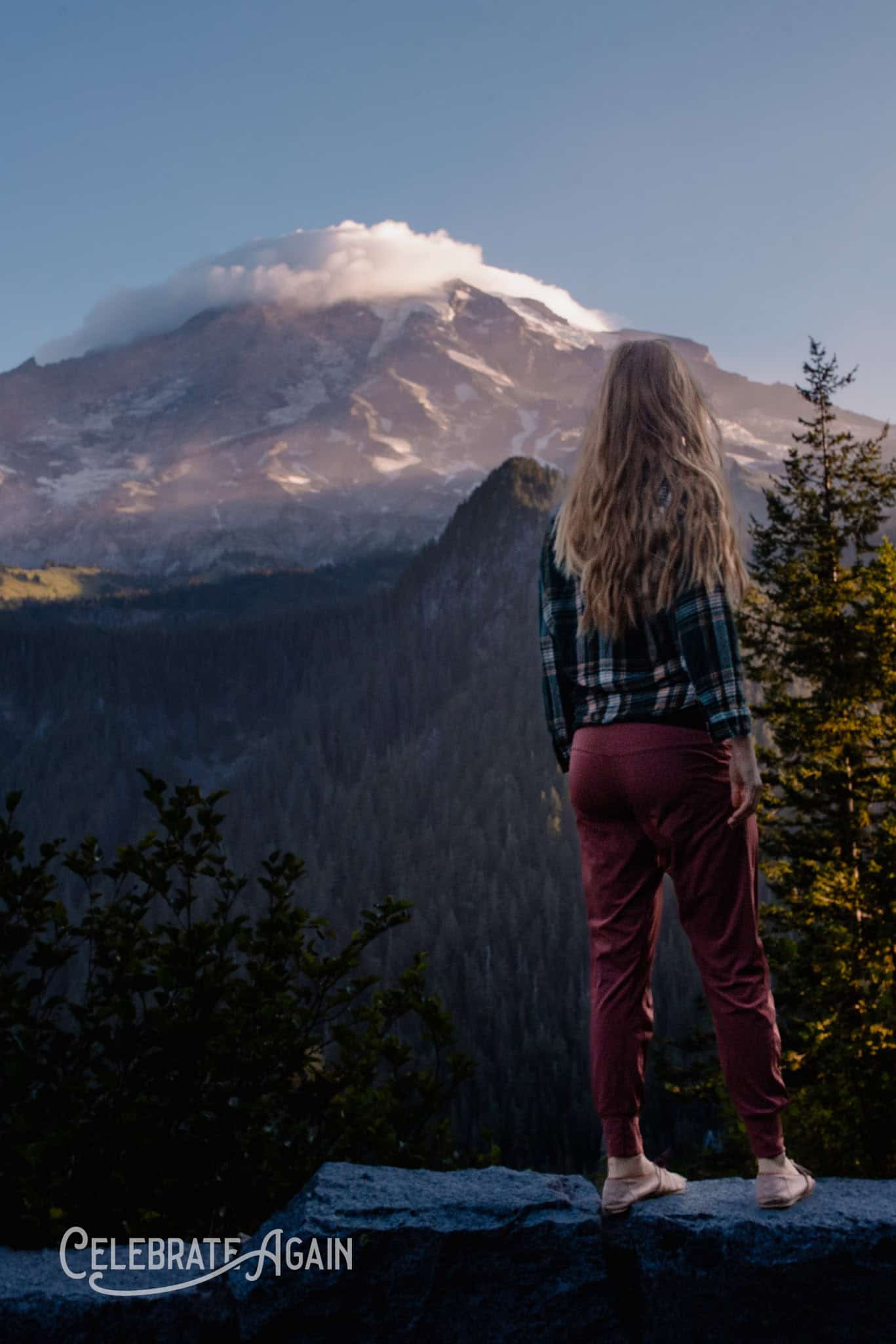 Woman in mountain background for poem about grief, longing and depression