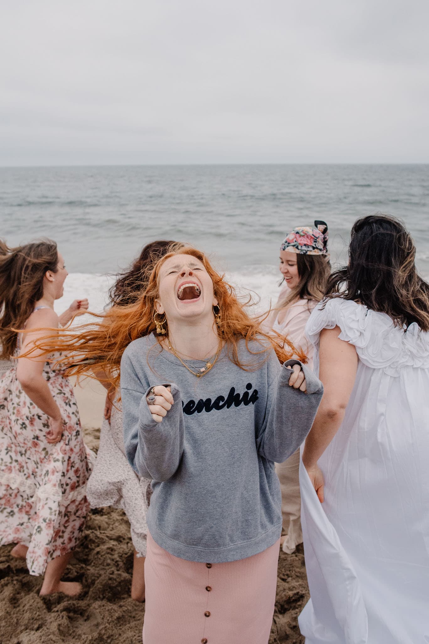 woman in joy in a group of women in an aliveness experiences