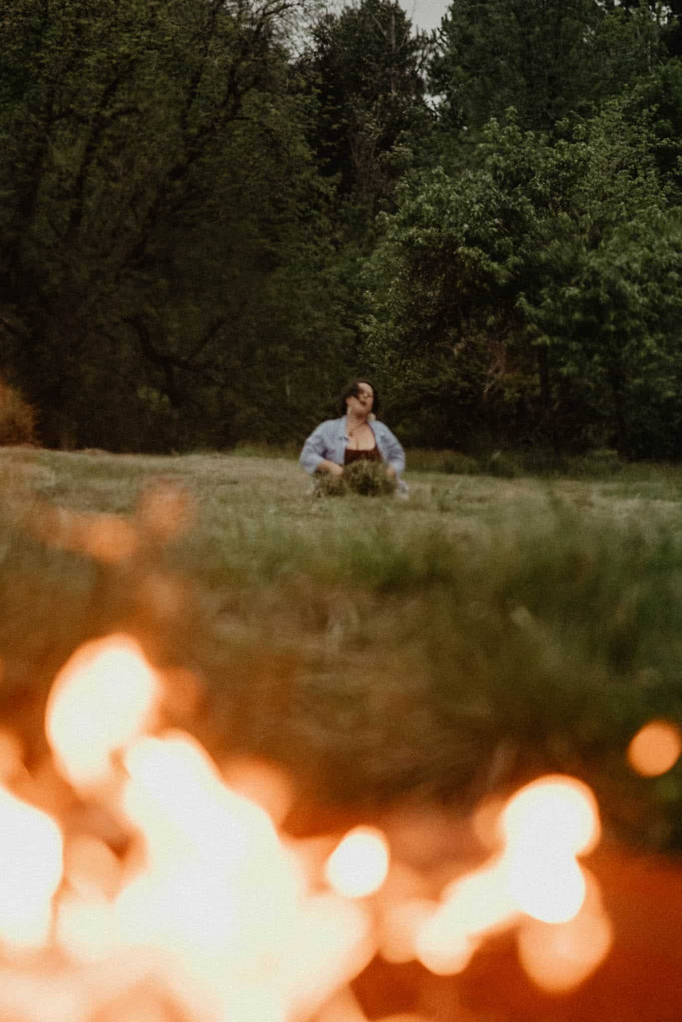 fire with woman in the background for a rage retreat in oregon