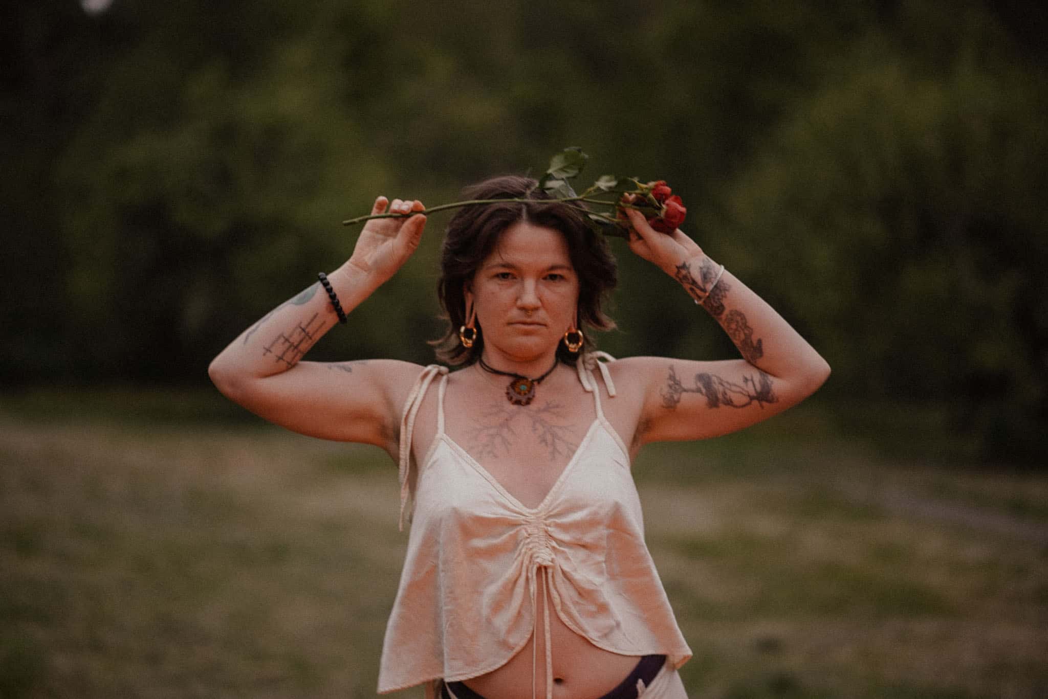 woman playing with a rose during a rage retreat in Oregon