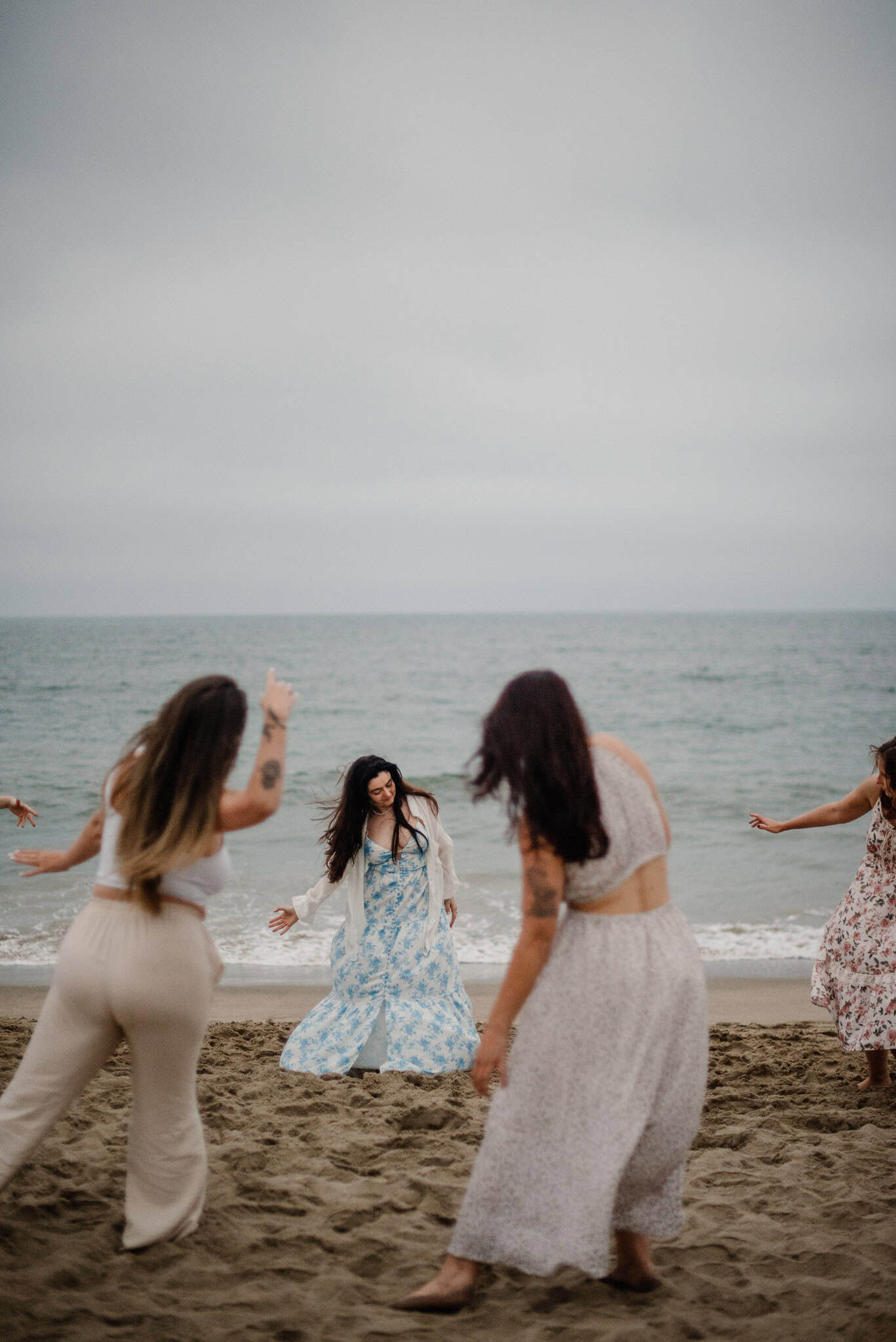 women near beach in a circle at a rage retreat in oregon
