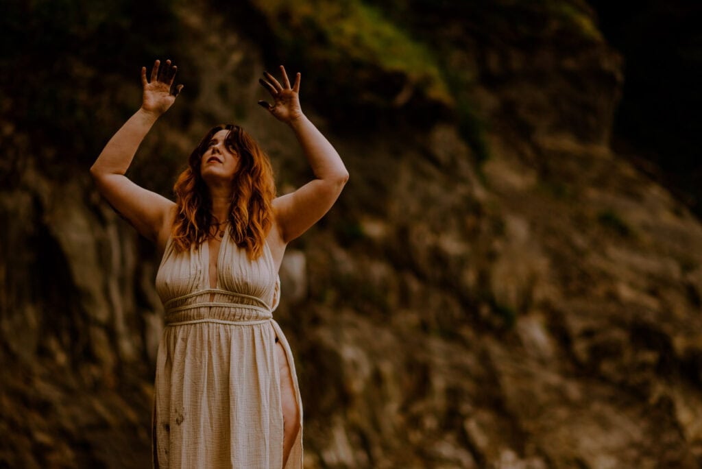 woman with her arms up during a rage retreat in Oregon